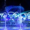 Professional dancer among the light and water for kiss of the sea show