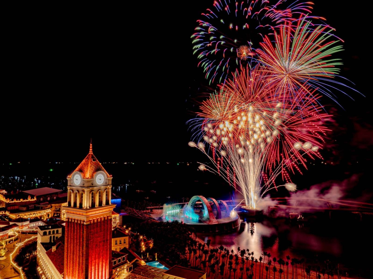 Beautiful firework and Clock Tower in sunset town phu quoc